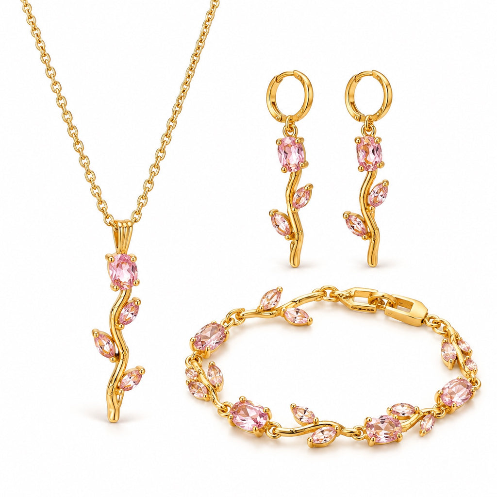 Gold-plated pink floral necklace, earrings and bracelet set on white background