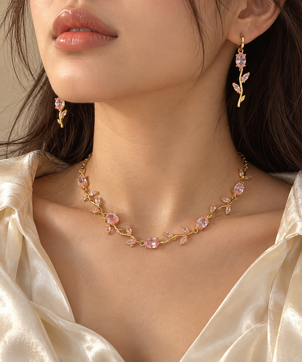 Model wearing the gold-tone pink floral necklace and matching earrings