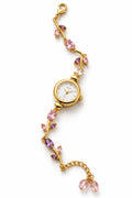 Pink crystal gold-tone floral tulip bracelet watch for women on white background